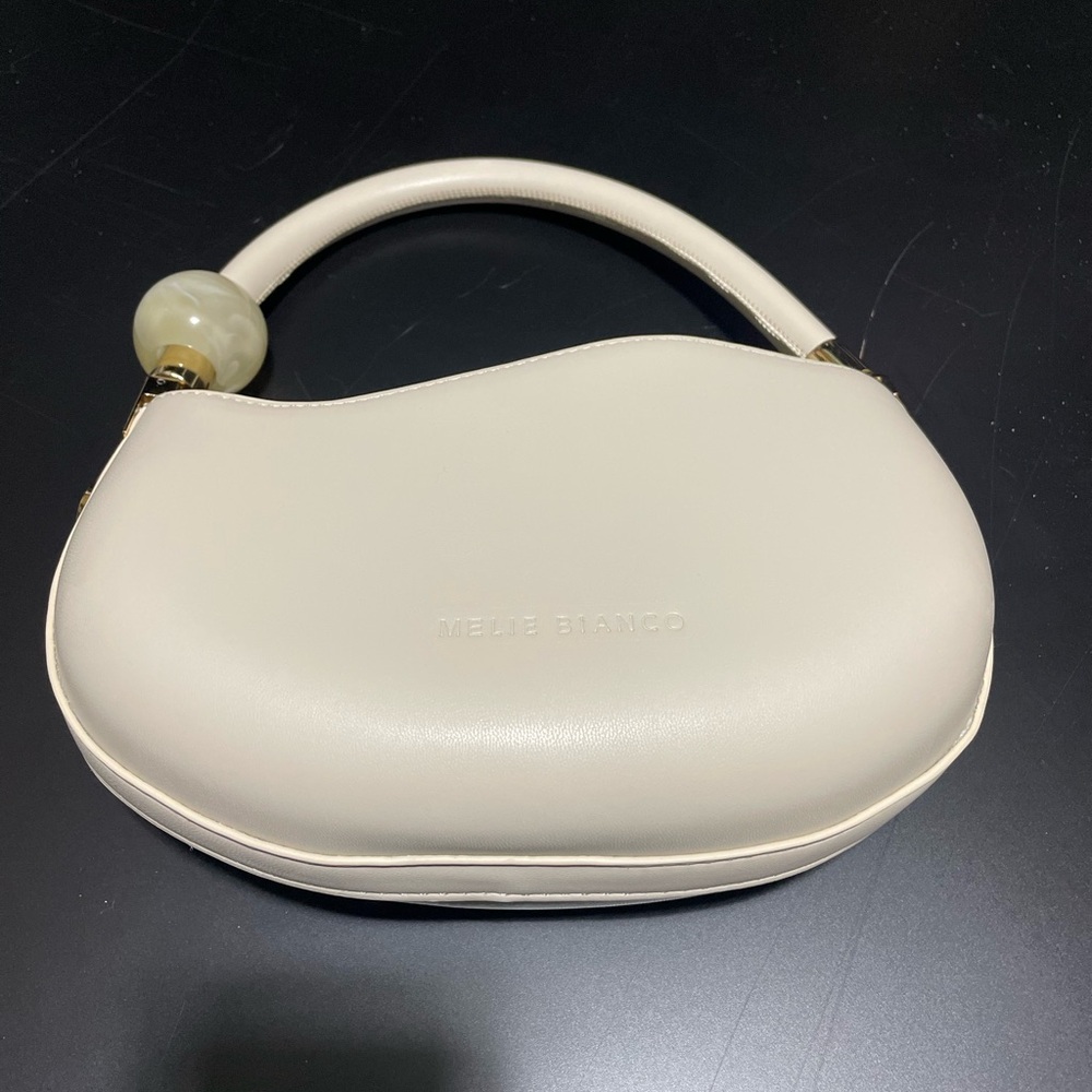 Melie Bianco Cream Clutch with Modern Elegance